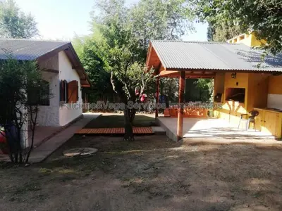 a house with a pavilion in front of it at Casita en Villa General Belgrano in Villa General Belgrano