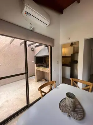 a kitchen with a table with a bowl on top of it at Departamento con pileta y asadores in Villa General Belgrano