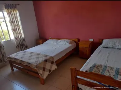 a bedroom with two beds and a window at Apart La Sole in Tanti