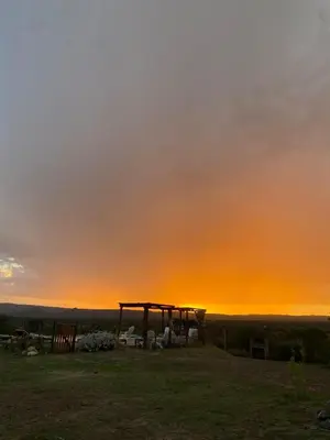 a view of the sunset from the top of a hill at La lomita de Nono in Arroyo de Los Patos