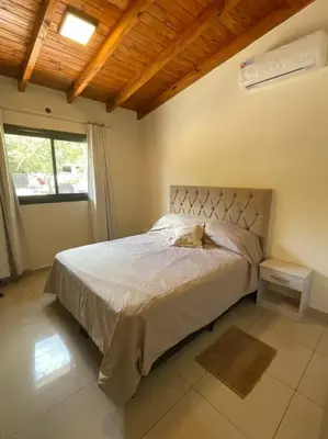 a bedroom with a bed in a room with a window at Casareartesesok in Los Reartes