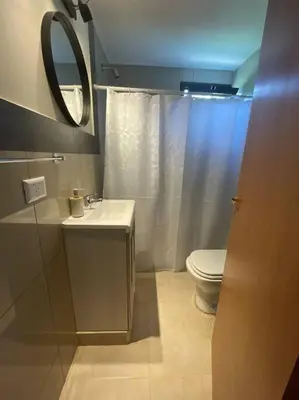 a bathroom with a toilet and a sink and a mirror at Casareartesesok in Los Reartes