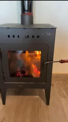 a oven with a fire inside of it at Casareartesesok in Los Reartes