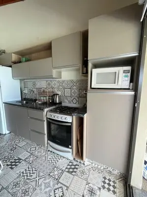 a kitchen with a stove and a microwave at Casareartesesok in Los Reartes