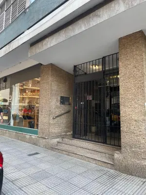 a store front with the doors open on a street at Pequeño y acogedor depto sin cocina, tiene freidora de aire y microondas in Cordoba