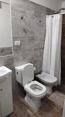 a bathroom with a toilet and a sink at Agradable departamento en Alta Córdoba in Cordoba