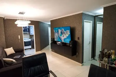 a living room with a couch and a painting on the wall at Perfect location Apartment in Nva Cba in Cordoba