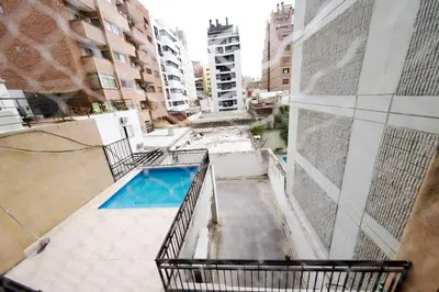 an empty balcony with a swimming pool in a building at Perfect location Apartment in Nva Cba in Cordoba
