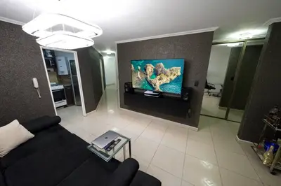 a living room with a couch and a flat screen tv at Perfect location Apartment in Nva Cba in Cordoba