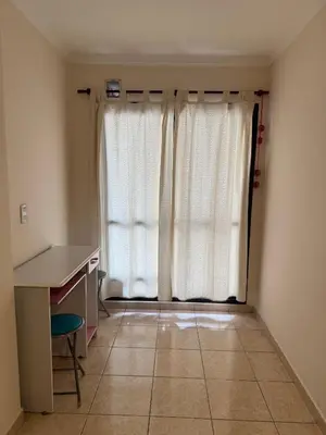 a room with a desk and a window with white curtains at Precioso y Muy Cómodo Departamento en Excelente Zona Centrica in Cordoba