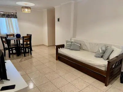 a living room with a couch and a table at Precioso y Muy Cómodo Departamento en Excelente Zona Centrica in Cordoba