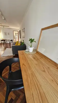 a living room with a table with a plant on it at Bravo 6 - Luminoso y amplio depto cerca de todo! in Cordoba