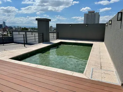 a swimming pool on the roof of a building at Alojamiento entero para 4 personas F in Cordoba