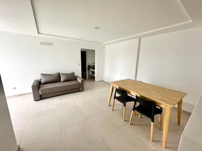 a living room with a wooden table and a couch at Alojamiento entero para 4 personas F in Cordoba