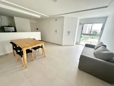 a living room with a wooden table and a couch at Alojamiento entero para 4 personas F in Cordoba