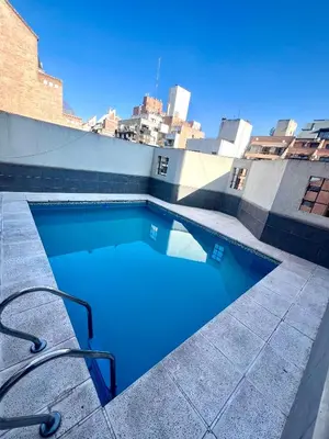 a swimming pool on the roof of a building at Departamento en el corazón de Córdoba in Cordoba