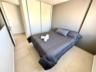 a bed with two towels on it in a room at Alojamiento entero para 3 personas D in Cordoba