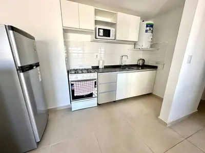 a white kitchen with a stove and a refrigerator at Alojamiento entero para 3 personas D in Cordoba