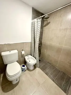 a bathroom with a toilet and a sink at Alojamiento entero para 3 personas D in Cordoba