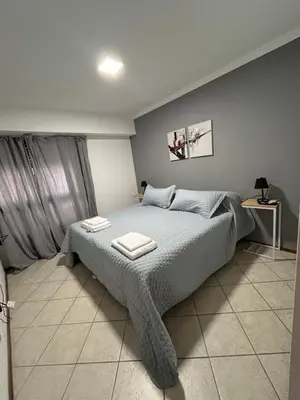 a bedroom with a bed with two towels on it at LA MEJOR UBICACIÓN de NUEVA CÓRDOBA in Cordoba