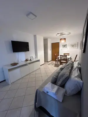 a living room with a bed and a dining room at LA MEJOR UBICACIÓN de NUEVA CÓRDOBA in Cordoba