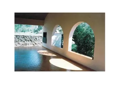 a room with two windows and a pool of water at Casa Con Pileta Exclusiva a 50 mtrs Rio in Villa Carlos Paz
