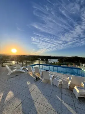 a group of white chairs sitting on top of a roof at Carlos paz resort premium in Villa Carlos Paz