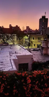 a rooftop of a building with a city in the background at Departamento en la Docta in Cordoba