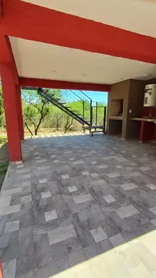 a large empty room with a view of a field at Refugio Serrano in Merlo