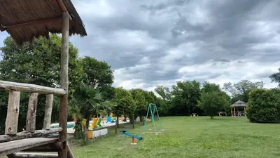 a park with a playground and a swing at BALCON De LA SIERRA in Las Calles