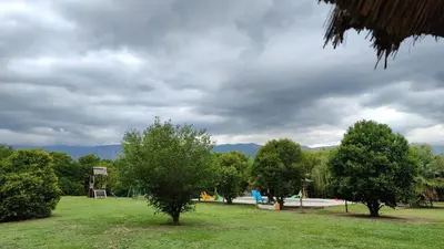 a park with trees and a playground in the background at BALCON De LA SIERRA in Las Calles