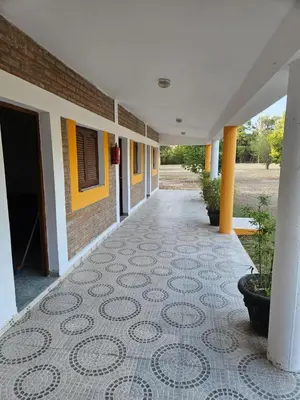 a hallway of a building with a tile floor at BALCON De LA SIERRA in Las Calles