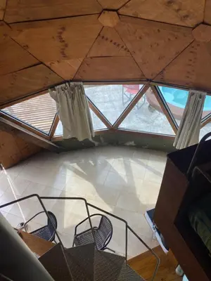 an overhead view of a room with a window and chairs at Domos in Santa Rosa de Calamuchita