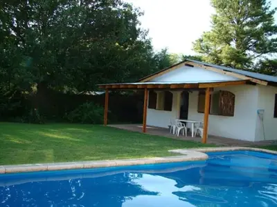 a house with a swimming pool in the yard at Casa Aurelia, San Javier, Córdoba in San Javier