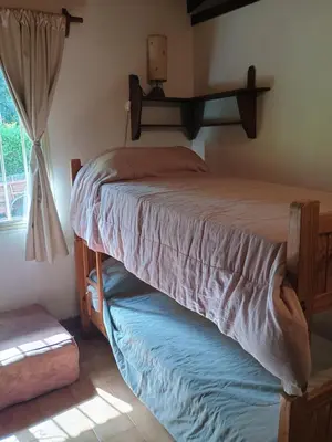 a bedroom with a bed and a window at Casa Aurelia, San Javier, Córdoba in San Javier