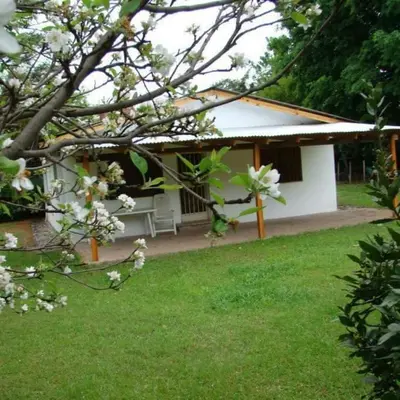 a white building with a picnic table in a yard at Casa Aurelia, San Javier, Córdoba in San Javier
