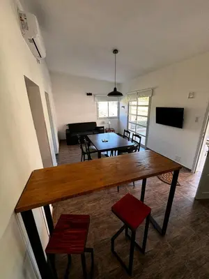 a living room with a table and two chairs at Cabañas Estrellas del Lago in Potrero de Garay