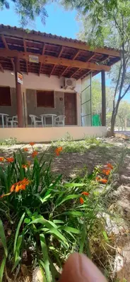 a building with a bunch of flowers in front of it at La Arcadia in Mina Clavero