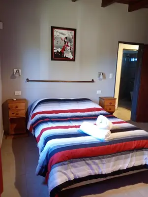 a bedroom with two beds with towels on them at Brisas del Lago in La Estancia