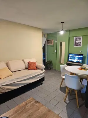 a living room with a couch and a table at En la cañada cerca de todo in Cordoba