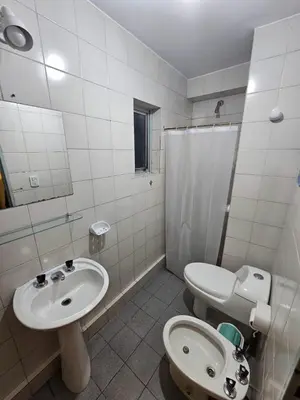 a bathroom with a sink and a toilet and a shower at En la cañada cerca de todo in Cordoba