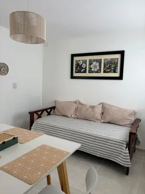a living room with a couch and a table at Departamento Roxi in Cordoba