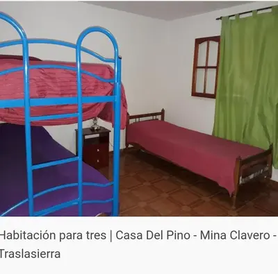 a room with two bunk beds in a room at Del pino in Mina Clavero