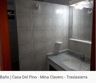 a bathroom with a sink and a mirror at Del pino in Mina Clavero
