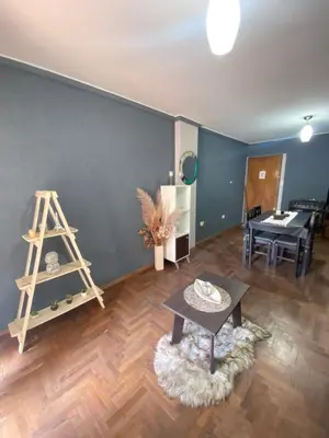 a living room with a ladder and a table at LitStay Paraná in Cordoba