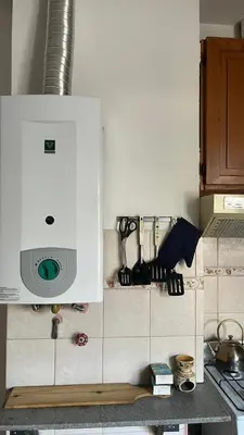 a kitchen with a counter top with a microwave at departamento moreno151 in Villa Carlos Paz