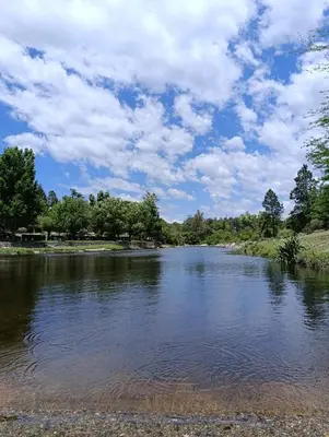 a view of a river with a cloudy sky at Silencio Dorado in Villa Serranita