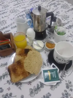 a plate with a piece of bread on a table at Habitación privada zona Centro, Tribunales y Patio Olmos in Cordoba