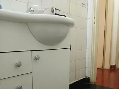a bathroom with a white sink in a room at Habitación privada zona Centro, Tribunales y Patio Olmos in Cordoba
