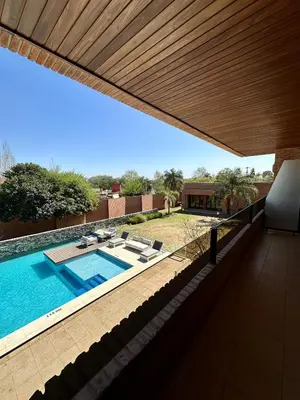 a view of a swimming pool from the patio of a house at Neper Hotel in Cordoba